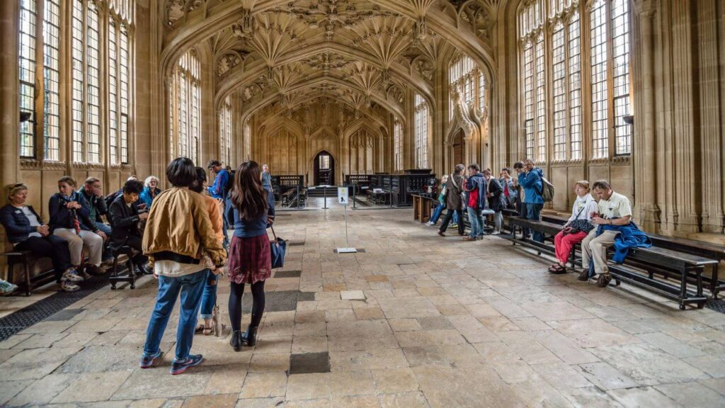 <p>The Bodleian Library in Oxford is one of the 26 libraries servicing the University of Oxford. It is one of the oldest and most iconic libraries in Europe. The Bodleian, or “the Bod,” has been housing books for around 400 years and currently holds more than 13 million printed materials.</p><p>The Bod was also one of the filming locations of the movie <em>Harry Potter and the Philosopher’s Stone.</em> The columns in the interior halls add a sense of mystery and magic, making it perfect for the wizard movie. This library is one of the most intricately designed Oxford buildings that perfectly shows classical architecture.</p>