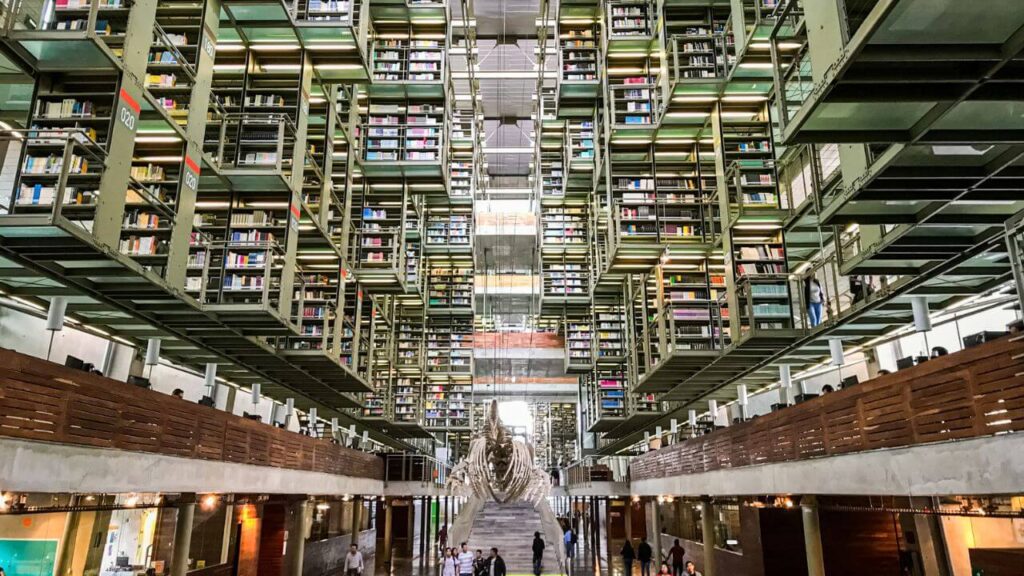 <p>The Biblioteca Vasconcelos, or Vasconcelos Library, is a contemporary library found in Mexico City. Established in 2006, the most distinct features of the building are the steel shelves and transparent walls that create a geometric illusion.</p><p>It earned the name “mega library” due to its modern design and the number of collections deposited in it (over 600,000). The library also has green spaces, such as a greenhouse and a garden, where you can walk around and explore. </p>