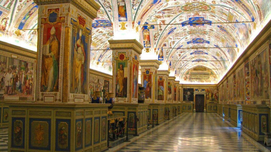 <p>The Vatican Library was started by Pope Nicholas V and completed under Pope Sixtus IV. The library was built to give scholars access to archival texts. Today, it holds some of the world’s most precious manuscripts.</p><p>Situated inside the Vatican Palace, the library’s Sistine Hall is adorned by paintings of religious figures. It is one of the most beautifully designed library interiors. Unfortunately, the Vatican Library limits its <a href="https://www.vaticanlibrary.va/en/information-for-readers/admission-criteria.html">admissions</a> to scholars, researchers, teachers, or graduate students. This is because of the nature and value of the artifacts deposited in the library.</p>