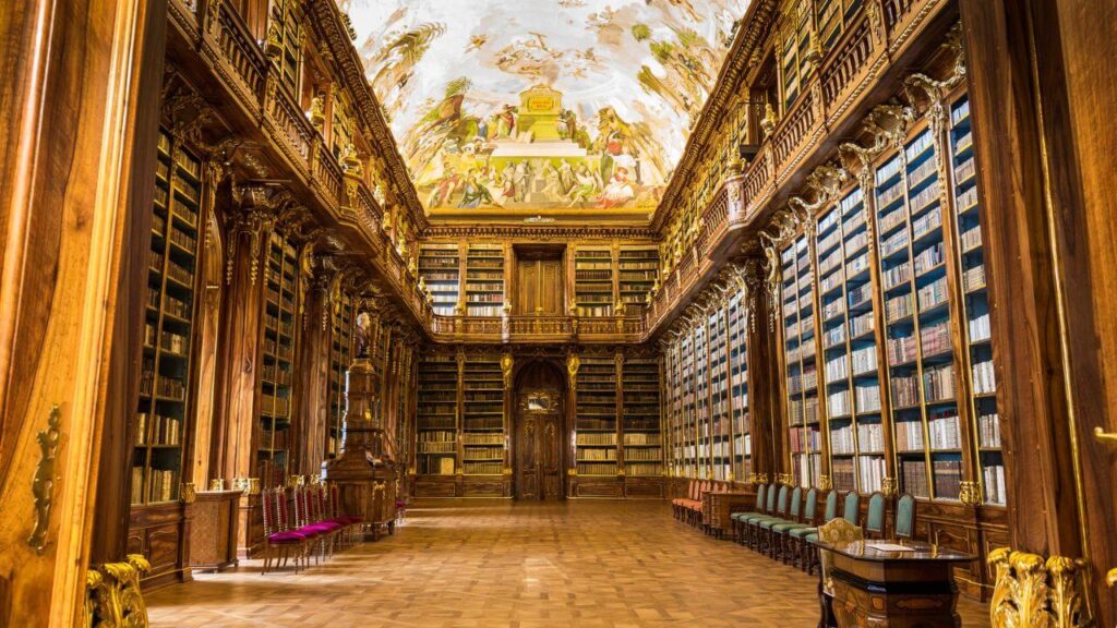 <p>The Strahov Library within the Strahov Monastery complex features architecture from both the 17th and 18th centuries. The Theological Hall (completed in 1679) and the Philosophical Hall (completed in 1794) are its main buildings.</p><p>Both halls are adorned with elaborate ceiling frescoes that emphasize the importance of knowledge in people’s lives. The Theological Hall’s frescoes were painted by Siard Nosecký, while the Philosophical Hall’s ceiling was decorated by Franz Anton Maulbertsch.</p>