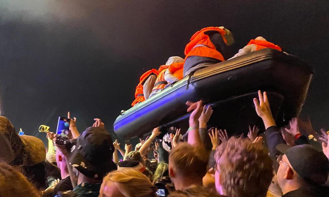 banksy launches inflatable migrant boat artwork during idles’ glastonbury set