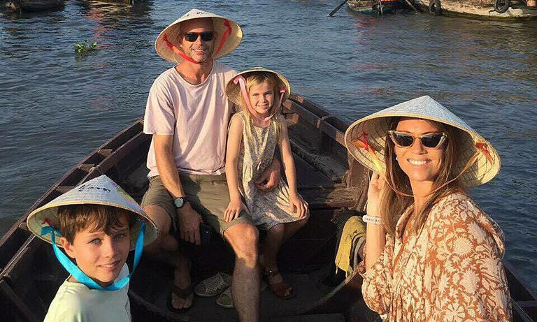 Foreign tourists take a boat tour on Cai Rang floating market in Vietnam's Mekong Delta, March 2024. Photo by VnExpress/Tam Dang