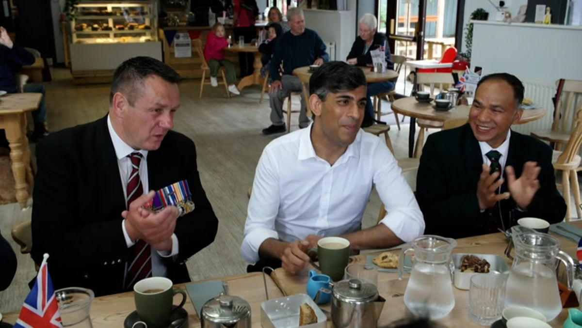 rishi sunak greeted by laughter from veterans during armed forces visit