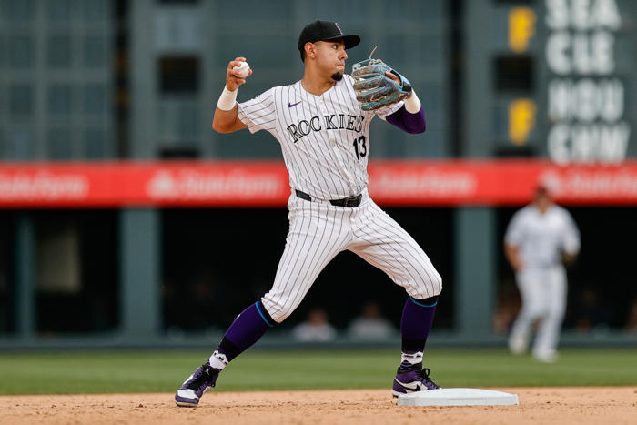 rockies infielder with dependable glove elects free agency