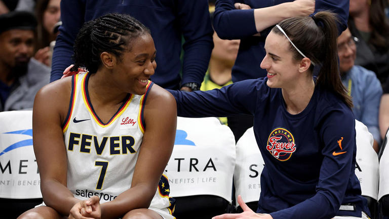 Aliyah Boston, #7, and Caitlin Clark, #22 of the Indiana Fever, sit on the bench before the game against the Seattle Storm at Climate Pledge Arena on June 27, 2024, in Seattle, Washington. Getty Images