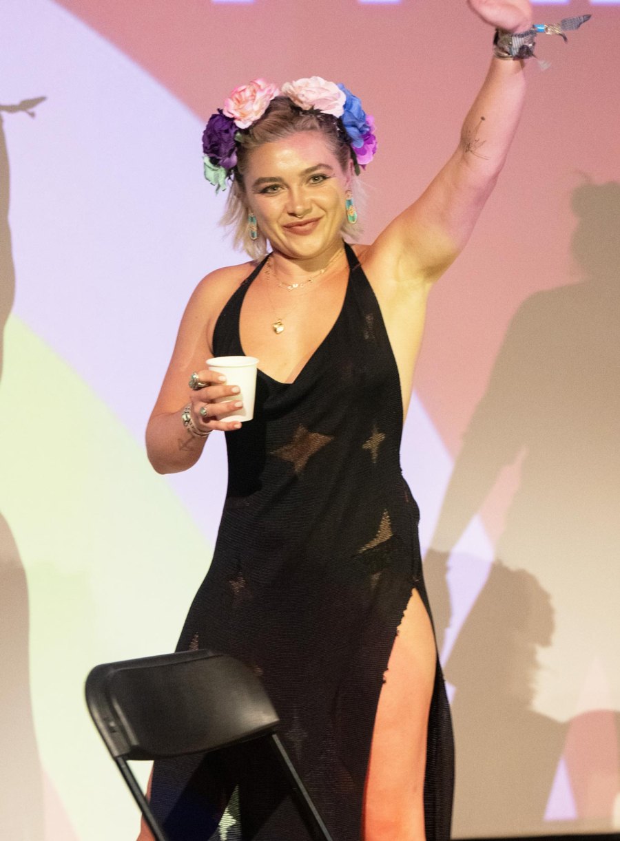 <p>The actress blended styles wearing a black floor-length halter-neck gown with thigh high slits, off-black combat boots and a flower crown.</p>
