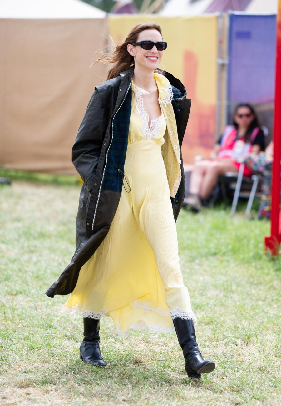 <p>Chung looked cozy in a long yellow dress with white lace detail along the v-neck and bottom. She accessorized with a long black coat, black knee-high boots and matching sunglasses.</p>