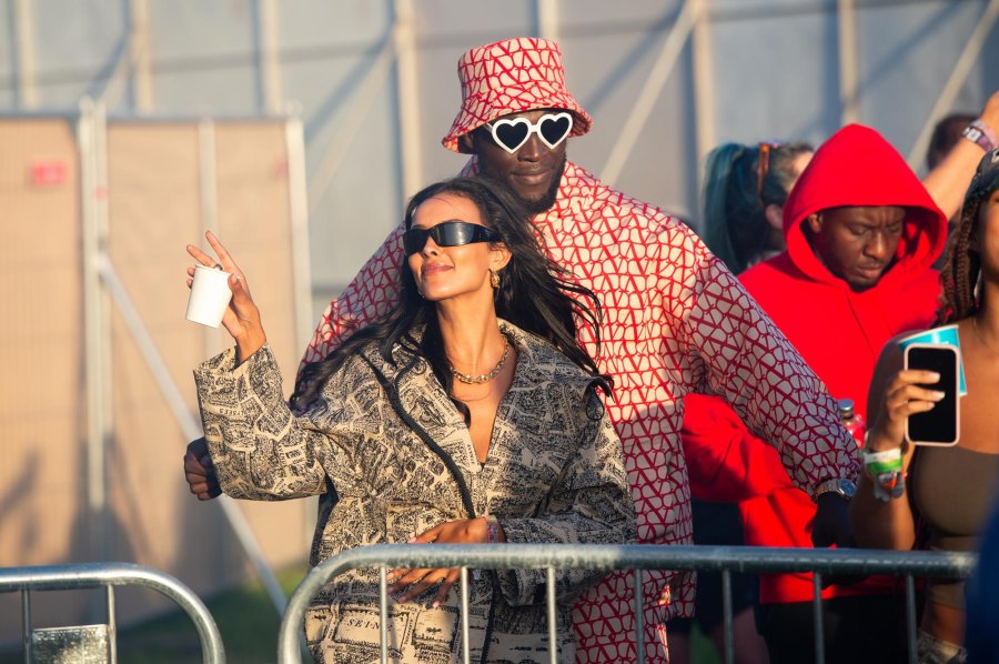 <p>Stormzy rocked a red and white geometric patterned set that consisted of a long-sleeve jacket, shorts and bucket hat. He accessorized with white heart-shaped sunglasses. Maya Jama wore a matching army print jacket and skirt set, which she paired with a black tube top, black sunglasses, a gold chain and gold earrings.</p>