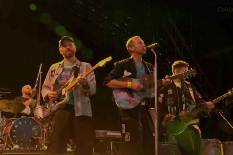 glastonbury 2024: coldplay make history with michael j. fox on stage as tom cruise watches on