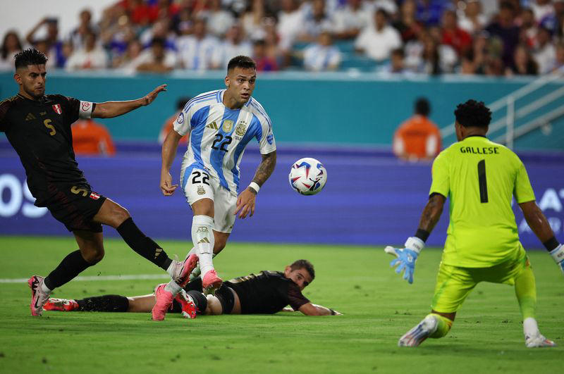 soccer-martinez double powers argentina to top of copa america group a