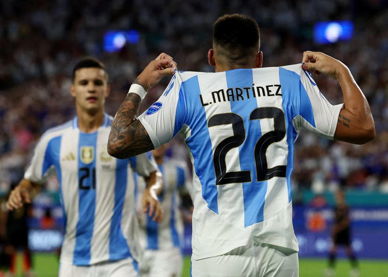 soccer-martinez double powers argentina to top of copa america group a