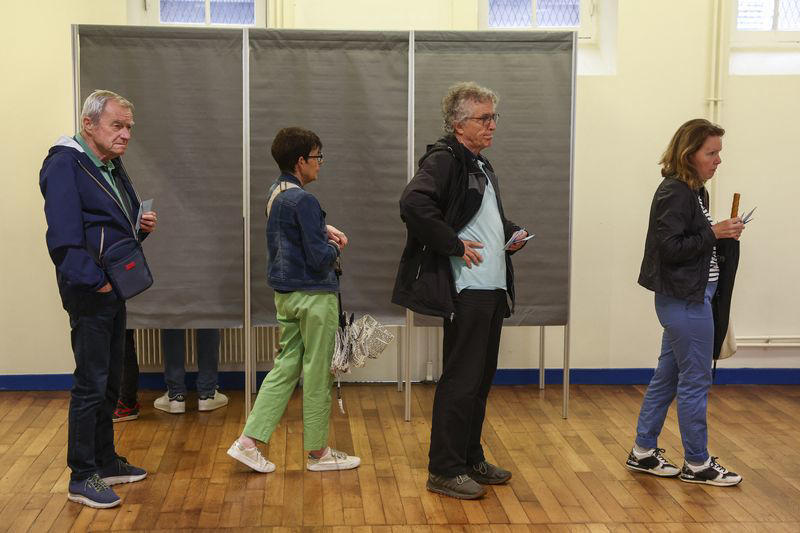 far right wins first round in france election, but final result uncertain, exit polls show