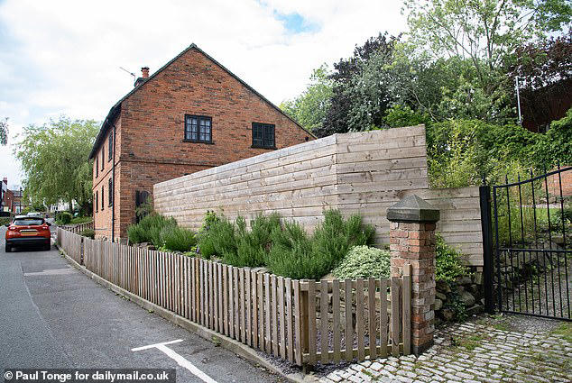 man told to tear down 8ft fence by 'ridiculous' council 'buffoons'