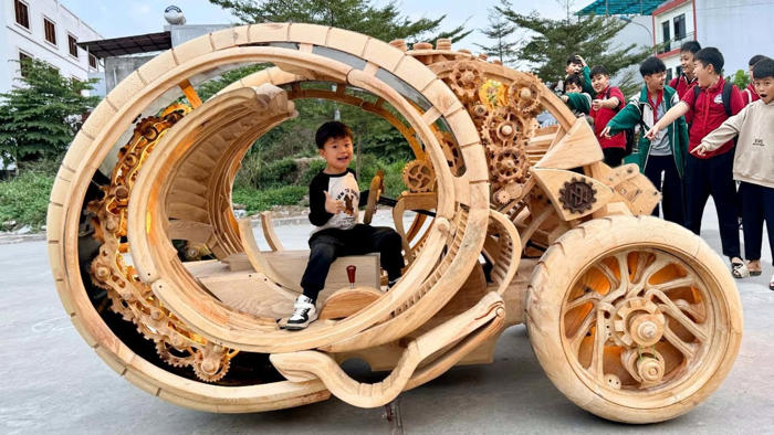 this trike was imagined using ai, and then made out of wood