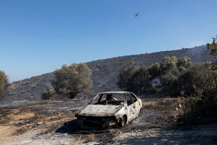 ‘apocalyptic’ wildfires in greece lead to tourist evacuations as five people injured in blaze