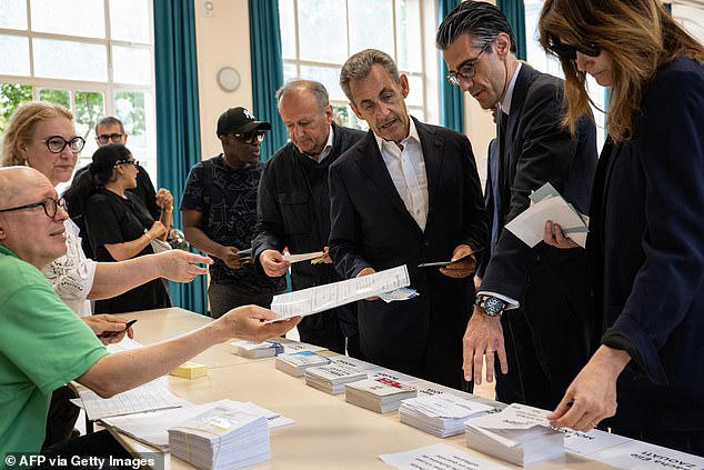 nicolas sarkozy and his wife cast vote in first round of snap election