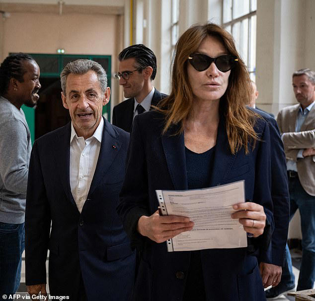 nicolas sarkozy and his wife cast vote in first round of snap election