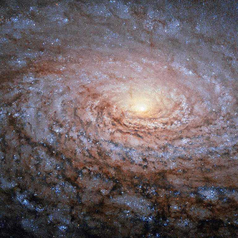 Slightly right of the centre, the galaxy’s core glows in yellow. (Photo: NASA)