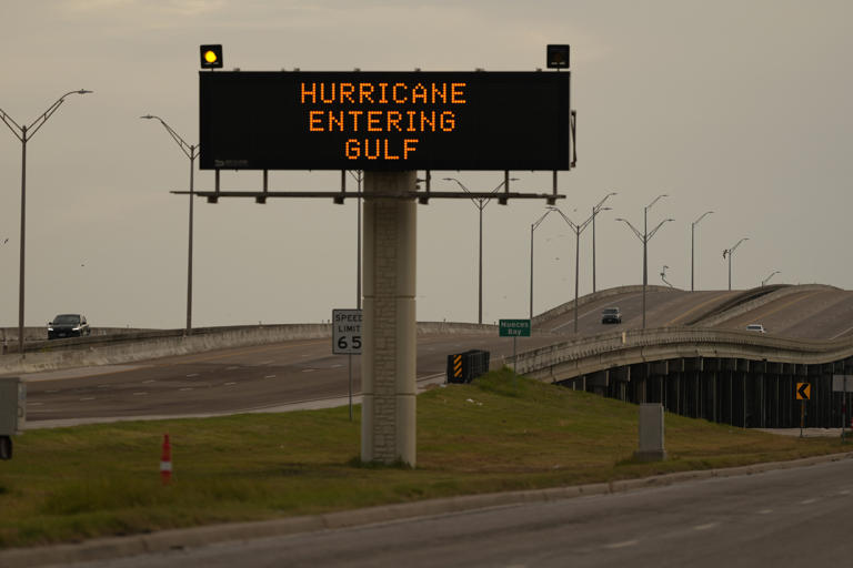 A sign in Texas warning of the incoming Hurricane Beryl, July 2024. Two cruise ships were spotted off the coast of Galveston when the hurricane was about to hit the mainland.