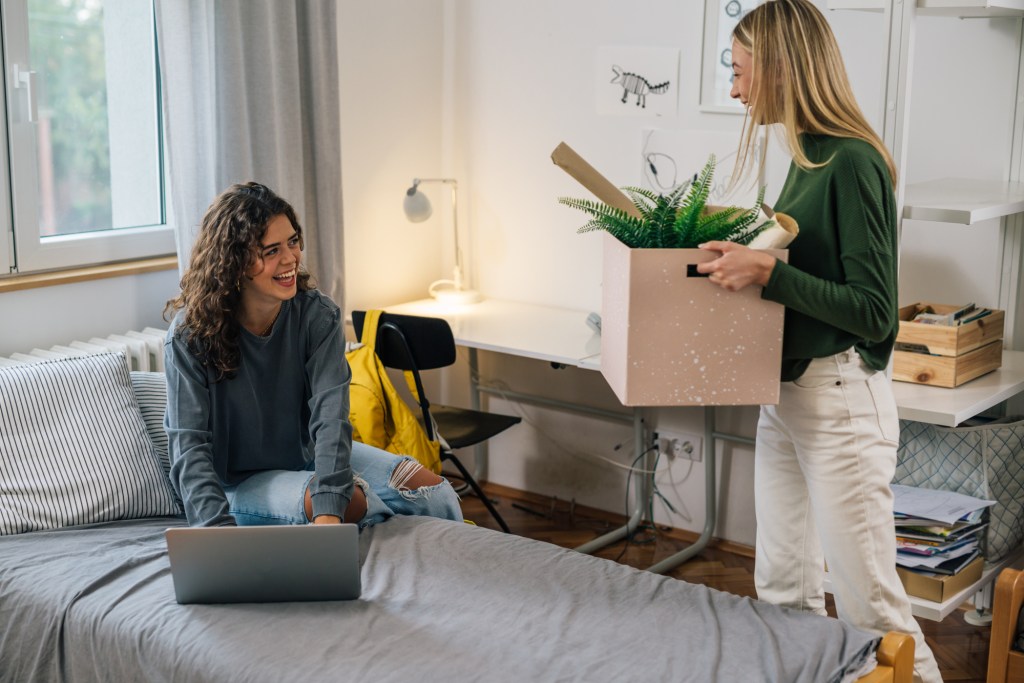 female college student move in dorm