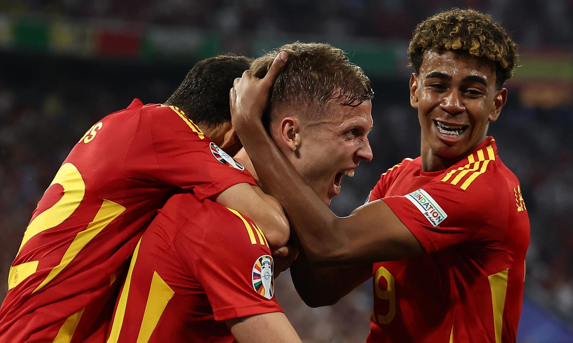 Daniel Olmo (centre) is congratulated after his deflected effort gave Spain the lead, four minutes after their first from Yamine Lamal (right). Photograph: Franck Fife/AFP/Getty Images