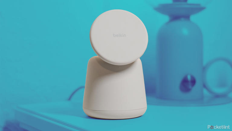 The Belkin Boost Charge Pro Dock on a nightstand that's been tinted different shades of blue. 