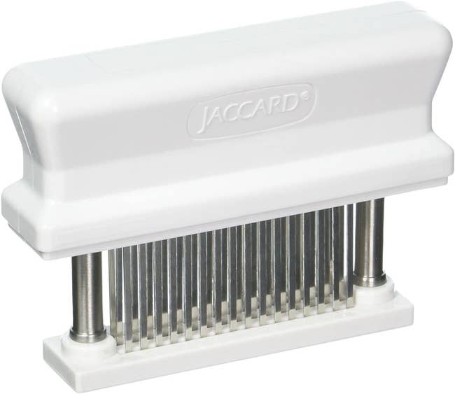 The tenderizer, which looks like a stamp and has teeth that tenderize the meat