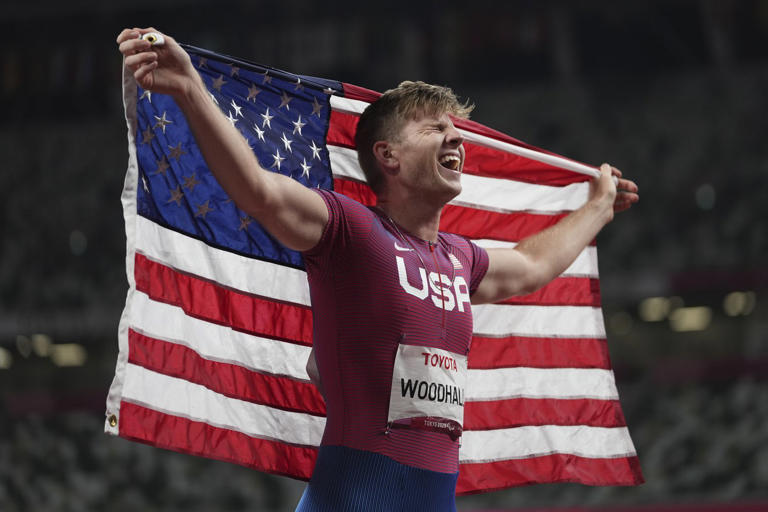 FILE - Hunter Woodhall of the U.S. celebrates after finishing third during the men's T62 400m final at the Tokyo 2020 Paralympic Games, Friday, Sept. 3, 2021, in Tokyo, Japan. This year, the year of the Paris Olympics and Paralympics, is not about coming close or showing up unprepared. (AP Photo/Emilio Morenatti, File)