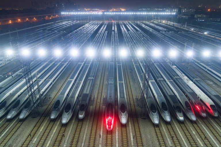 High speed trains are lined up after undergoing maintenance in preparation for the annual Lunar New Year travel peak, at a maintenance base in Wuhan, in China's central Hubei province early on January 26. China built the world's largest high-speed rail network in just a couple decades. Getty Images