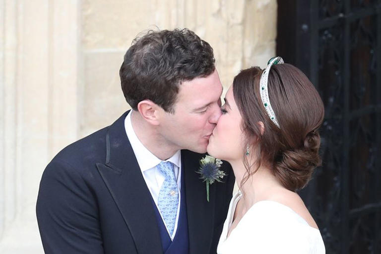 Princess Eugenie and her new husband Jack Brooksbank kiss as they leave St George's Chapel in Windsor Castle