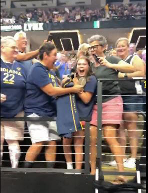 A young fan is overjoyed to get Caitlin Clark’s sneakers after the Fever’s win on Sunday. Fever/X