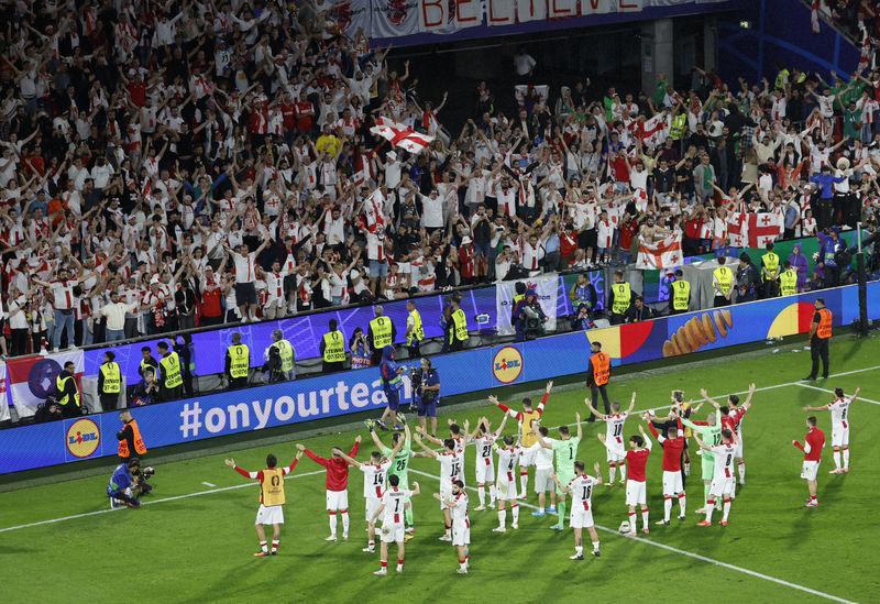 soccer-supreme spain reach euros last eight to shatter georgia dreams