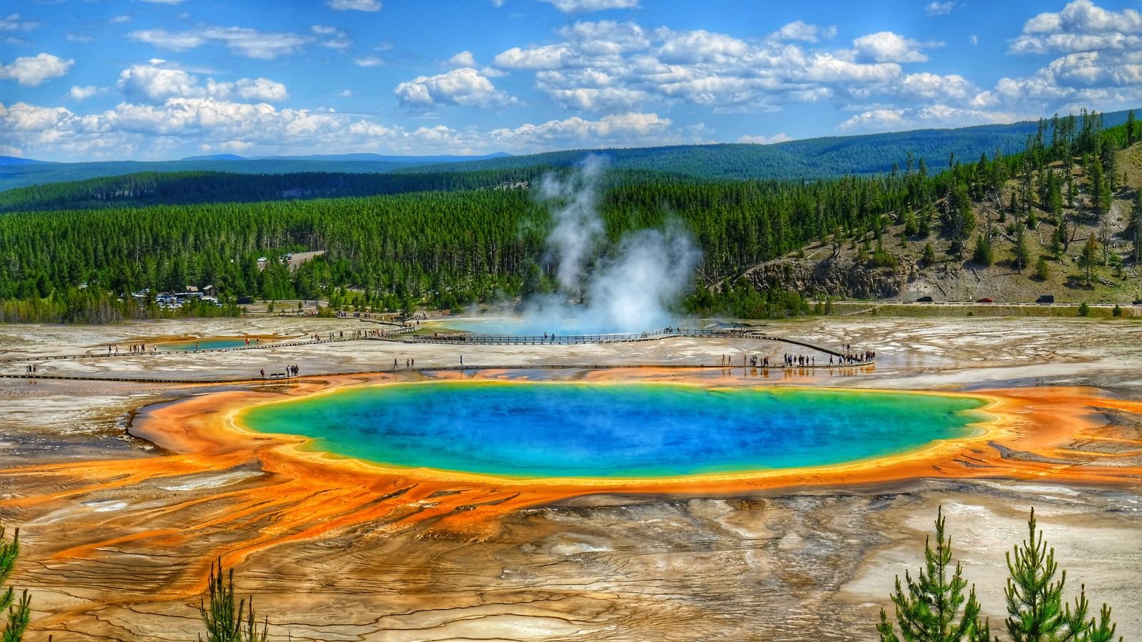 <p>The Grand Prismatic Spring is known as the largest hot spring in the United States. Due to the bright colors, the spring resembles a giant rainbow-colored circle. It’s one of the most beautiful spots in the park, and many visitors consider it a must-see if they visit Yellowstone.</p>