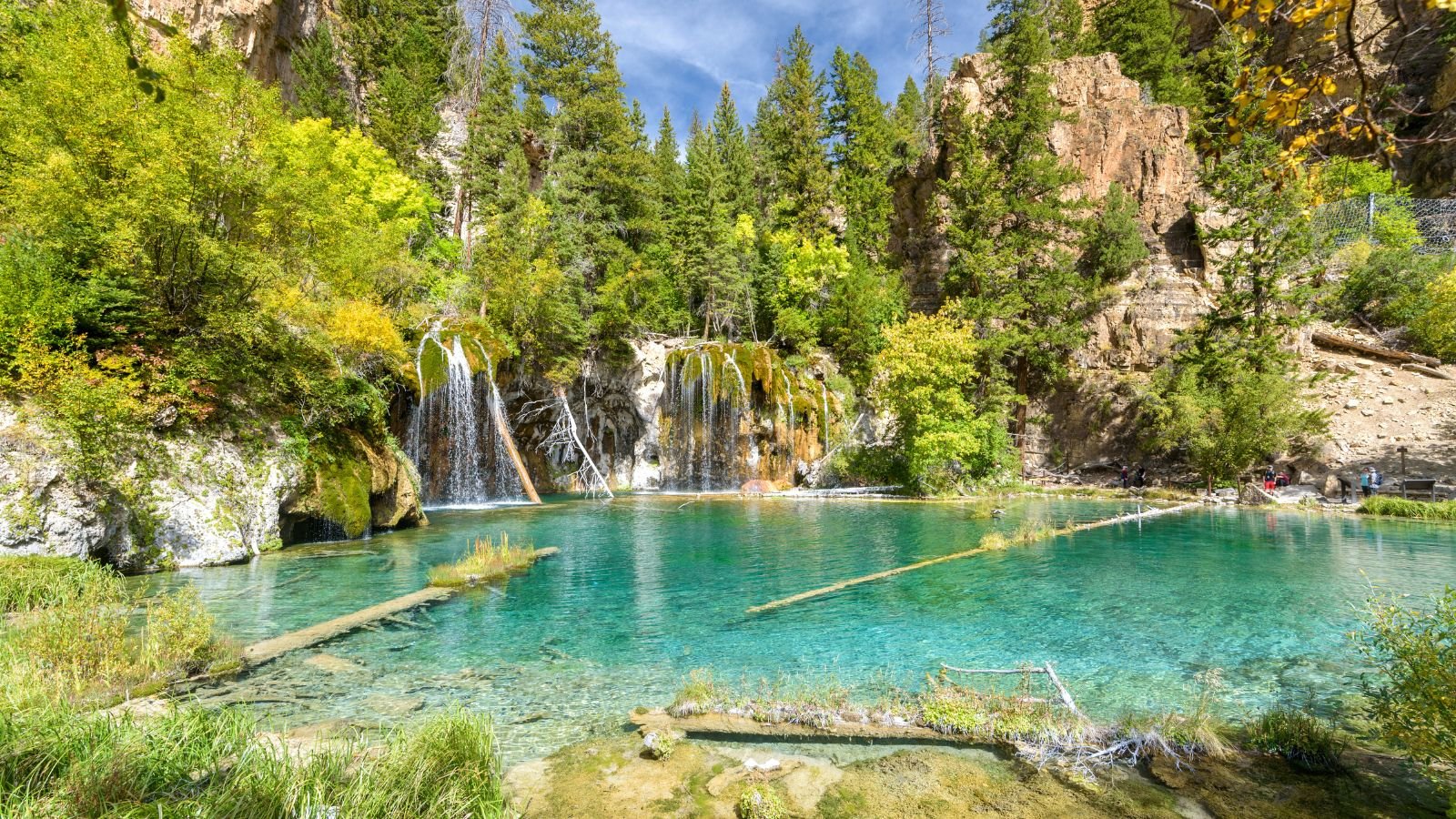 <p>Hanging Lake in Colorado is a very famous place for hiking. The water there is clear and has a turquoise color because of the carbonated minerals in the water. You can even see trees and branches under the water. Moreover, the waterfalls there make the whole place even more beautiful.</p>