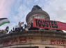 Protests erupt in Paris over Marine Le Pen