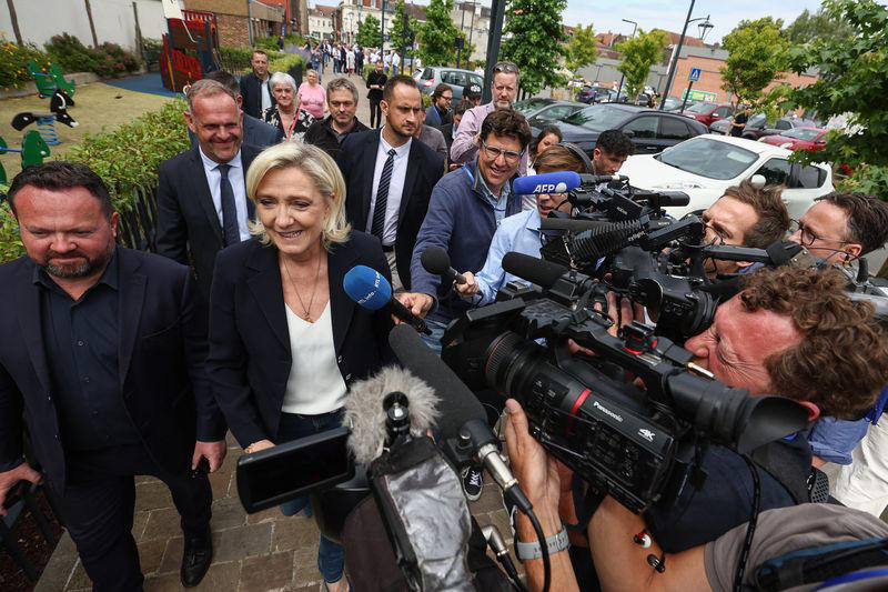 far right leads france election, but final result remains uncertain, exit polls show