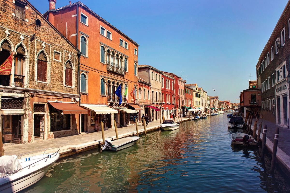 <p>Just 1.5km to the north of Venice lies one of its most famous nearby islands: Murano, which can be accessed by the same <em>vaporetto</em> as Burano. Of all its many charms, Murano is perhaps most famous for its glassmaking, which has been thriving here since the 1200s. To this day, you can visit modern glassmaking shops and factories on the island to witness how this world-famous material is made, as well as popping into the Murano glass museum to see historical pieces. </p><p>This is the second largest island in the lagoon – after Venice – but only has around 7,000 inhabitants. As well as glassware, it's known for its beautiful architecture, including colourful houses and artfully faded historic buildings.</p><p>Murano is an important stop on <em>Good Housekeeping</em>'s river boat cruise <a href="https://www.goodhousekeepingholidays.com/tours/islands-cruise-venice">tour of the Venice islands</a> and a special trip with <a href="https://www.goodhousekeepingholidays.com/tours/russell-watson-venice">classical singer Russell Watson</a>. Excursions here are combined with stops on neighbouring Burano and Torcello, so you'll get an authentic feel for the area.</p><p><a class="body-btn-link" href="https://www.goodhousekeepingholidays.com/tours/russell-watson-venice">DISCOVER MURANO WITH GH</a></p>