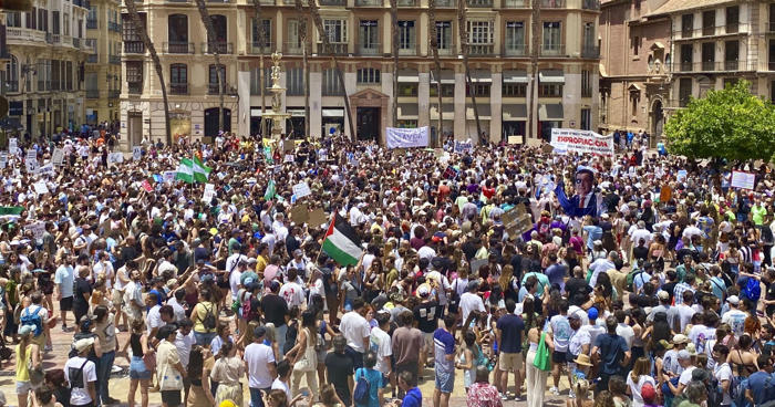 malaga residents rally against wave of excessive tourism