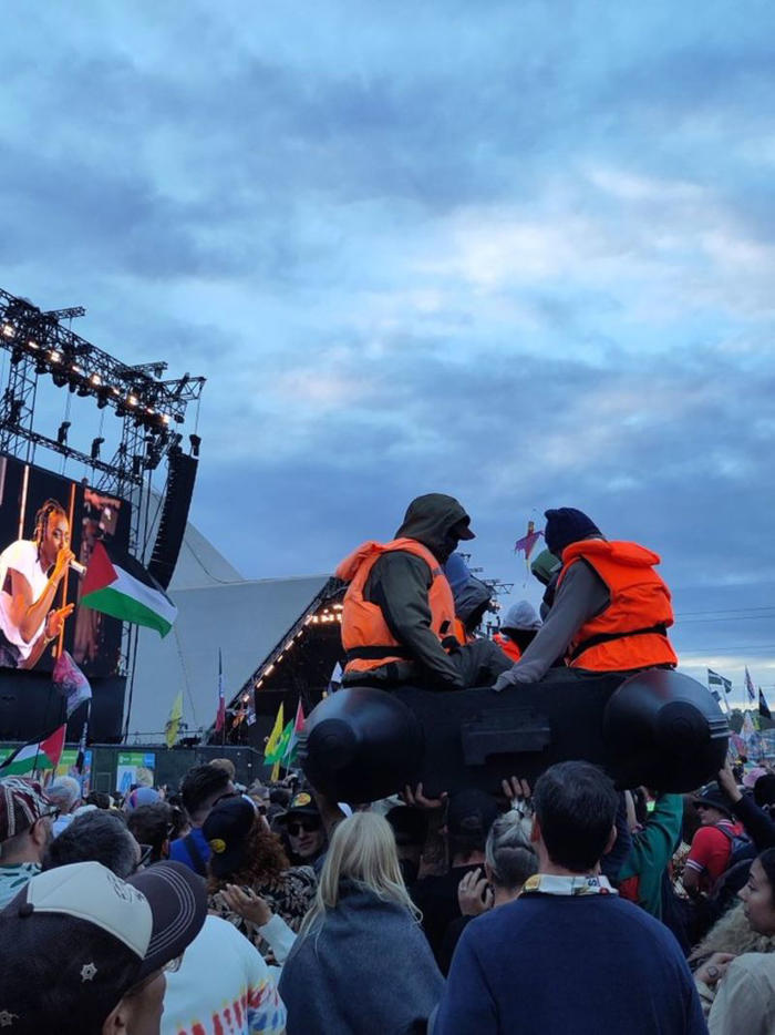 banksy confirms migrant boat prop at glastonbury festival was his artwork