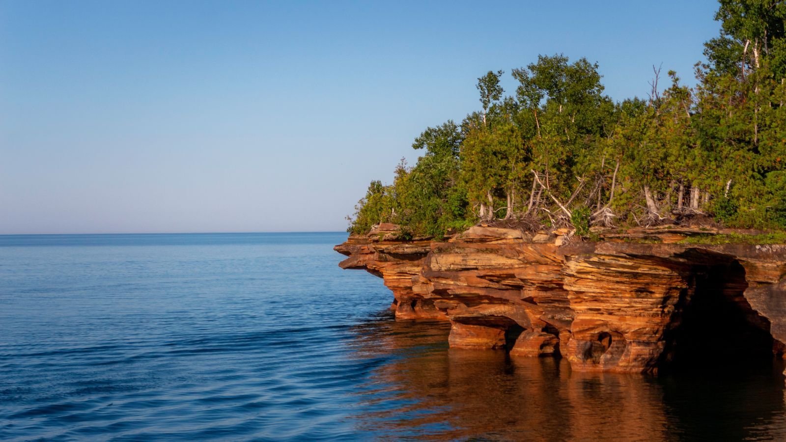 <p>Apostle Islands National Lakeshore in Wisconsin is a great place for people who love outdoor activities regardless of the season. In the warmer months, you can go kayaking through sandstone cliffs shaped by the waves. In the winter, you can walk across the frozen lake to see the beautiful ice caves.</p>