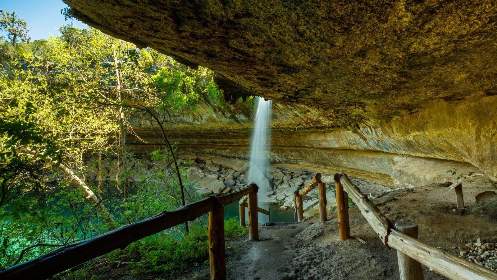 <p>Hamilton Pool Preserve, located near Austin, Texas, features a 50-foot waterfall and beautiful greenish-blue waters. It’s an ideal location for hiking and relaxing in a natural swimming pool. This place was formed long ago when an underground river’s roof collapsed.</p>