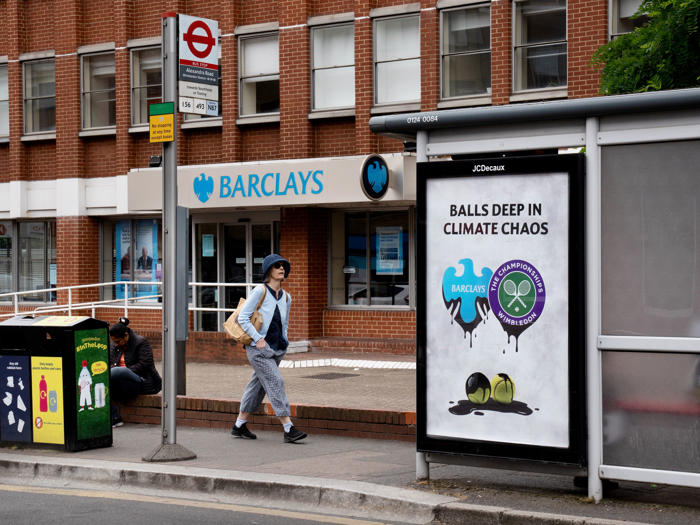 billboards calling on wimbledon to drop barclays as sponsor appear near all england lawn tennis club