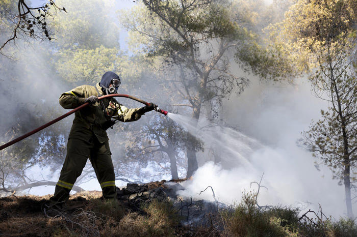 firefighters tackle blazes on greek islands of chios and kos as premier warns of 'dangerous summer'