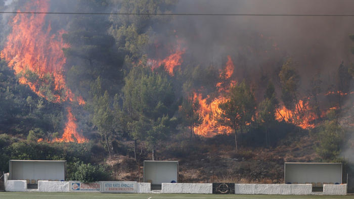 'everyone is anxious': holidaymaker tells of 'apocalyptic' scenes on greek island as pm warns of more wildfires
