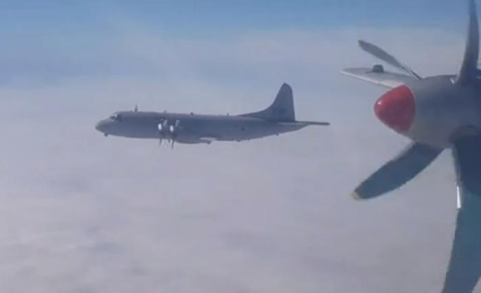 tense moment russian spy plane is intercepted by nato jet