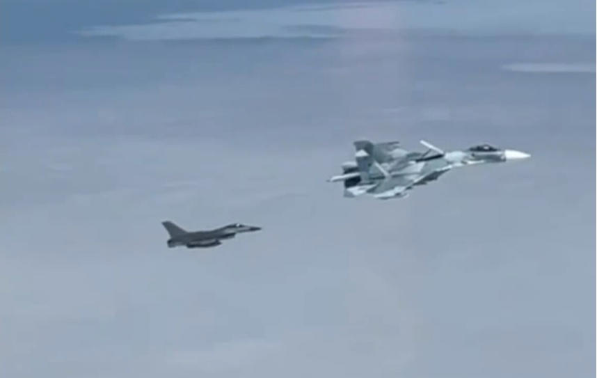 tense moment russian spy plane is intercepted by nato jet