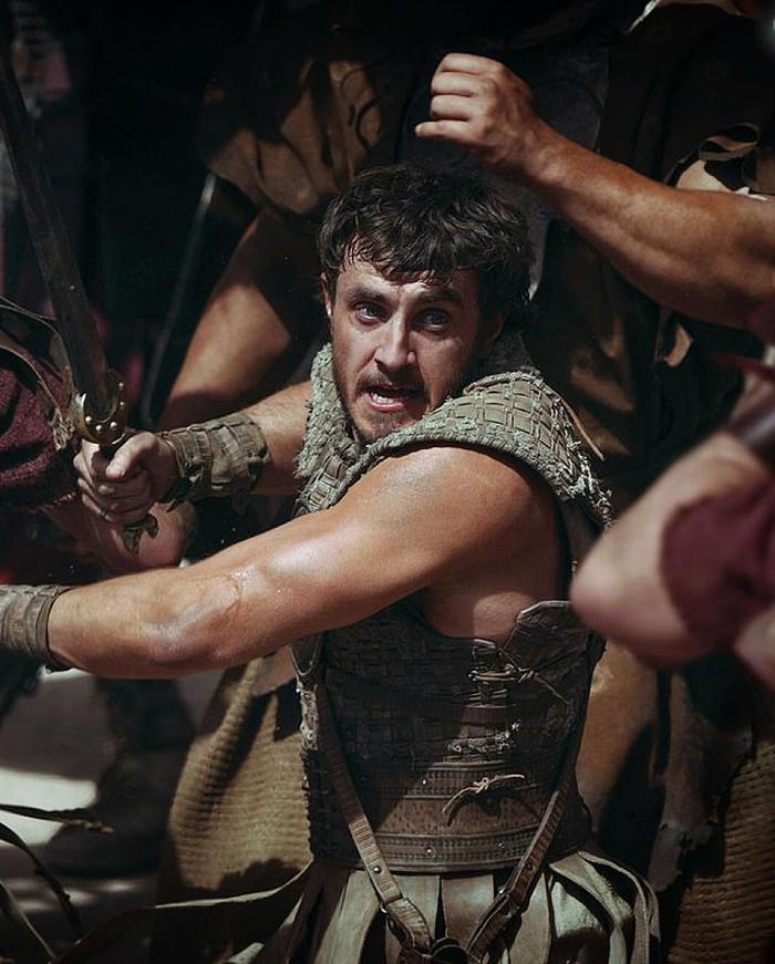 gladiator 2 first look: shirtless paul mescal showcases his rippling muscles in battle gear as he duels blood soaked pedro pascal in the much anticipated sequel - 24-years after the oscar-winning original