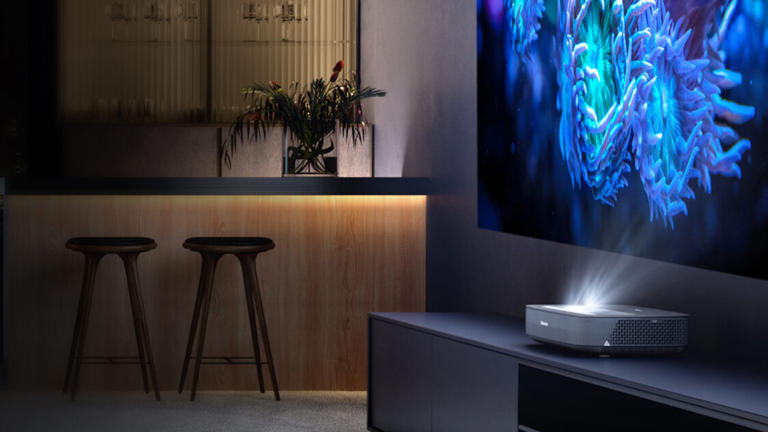 Hisense's PL1TUK in action, demonstrating the space-efficient convenience of ultra-short-throw projection (Image credit: Hisense)