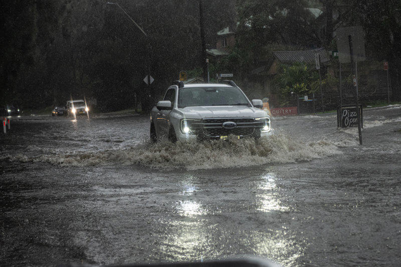 northern beaches suburbs cut off after massive ‘tropical’ downpour