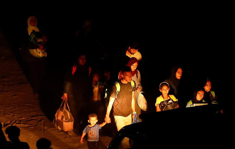 thousands flee their homes as israeli forces bomb southern gaza